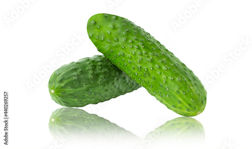 Two green cucumbers isolated on white background with reflection