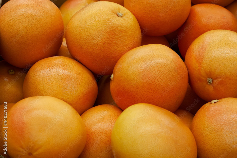 Background of ripe grapefruits in the store Background of ripe grapefruits in the store