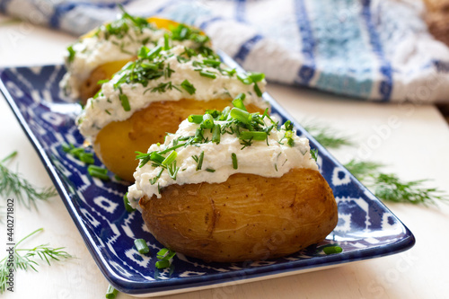 Baked potatoes with cottage cheese paste called "gzik" sprinkled with chives and dill