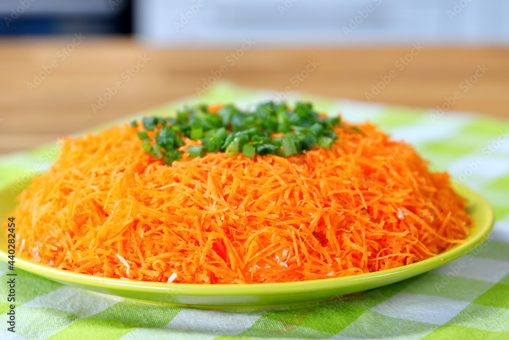 salad of crab sticks, carrots, smoked cheese and sauce. Food on the festive table is cooked at home and ready to eat salad of crab sticks, carrots, smoked cheese and sauce. Food on the festive table is cooked at home and ready to eat