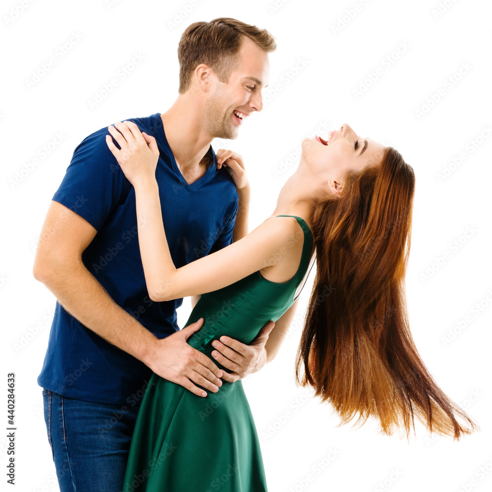 Fototapeta premium Portrait image of hugging young smiling couple, looking at each other. Caucasian models in love, relationship, dating, flirting, lovers, studio concept, isolated over white background. Square.