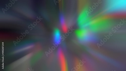 The glow of rainbow holographic chromatic lights zoom. Aura wave abstract background