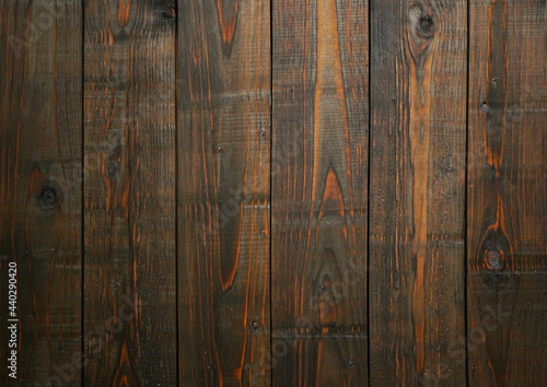 Background of boards covered with dark oil 