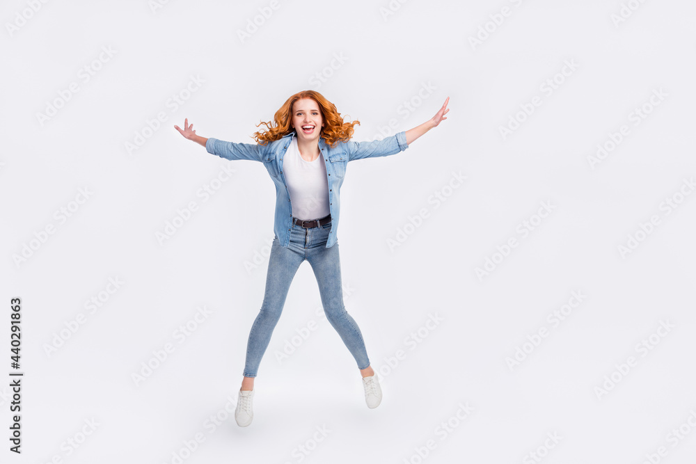 Full length photo of attractive happy nice positive lady jump up good mood smile isolated on grey color background