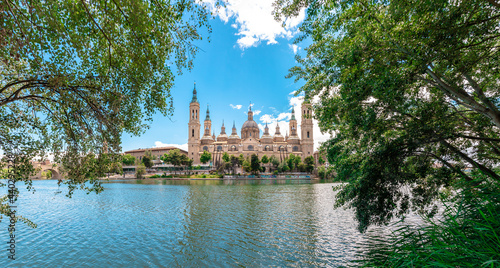 Picture of  Nuestra se  ora del Pilar  basilica in front of Ebro river captured during a sunny day. Zaragoza  Arag  n  Spain.