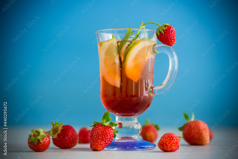 refreshing cool strawberry lemonade with lemon, ice and mint in a glass refreshing cool strawberry lemonade with lemon, ice and mint in a glass