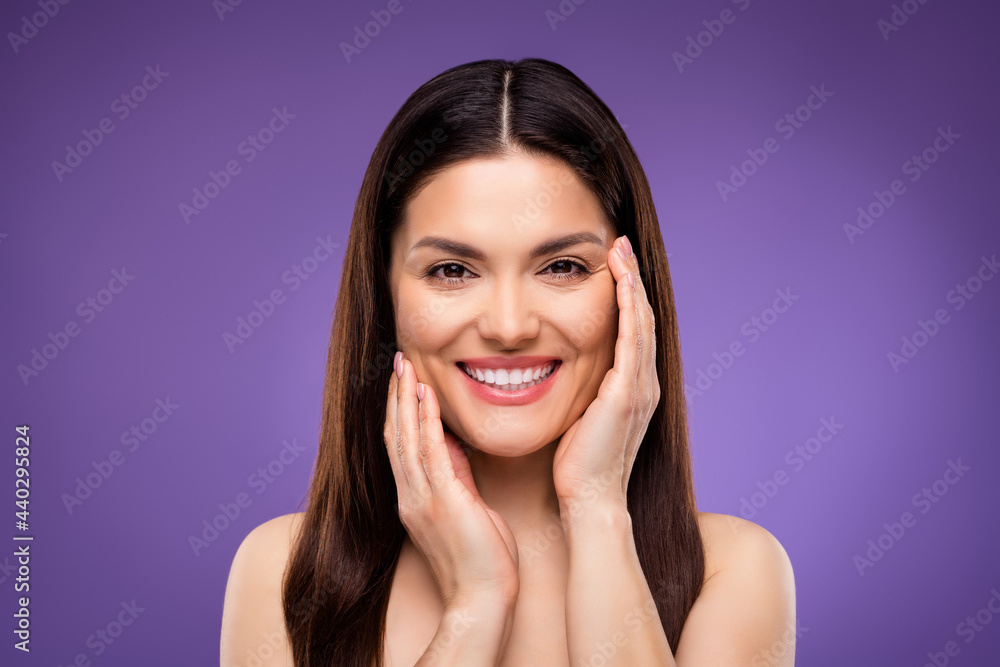 Photo of shiny cute young lady wear nothing arms cheeks smiling isolated purple color background Photo of shiny cute young lady wear nothing arms cheeks smiling isolated purple color background