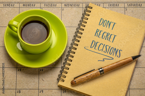 Φωτογραφία do not regret decisions - inspirational handwriting in a spiral notebook with a