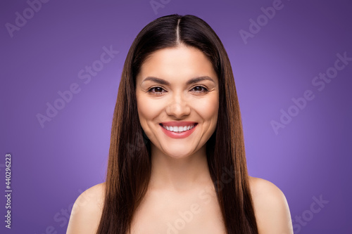 Portrait of nice attractive cheerful woman with perfect shine clean skin isolated over bright violet purple color background