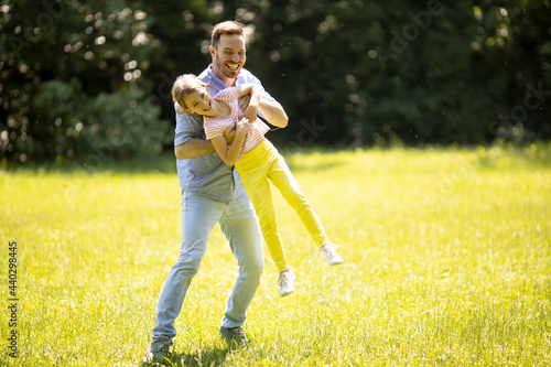 Father chasing his little d...