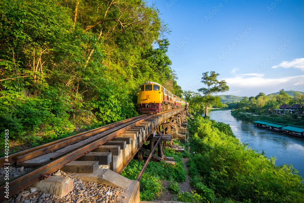 Fototapeta premium Thai Train on River Kwai Bridge of Kanchanaburi built in World War 2 , Thailand