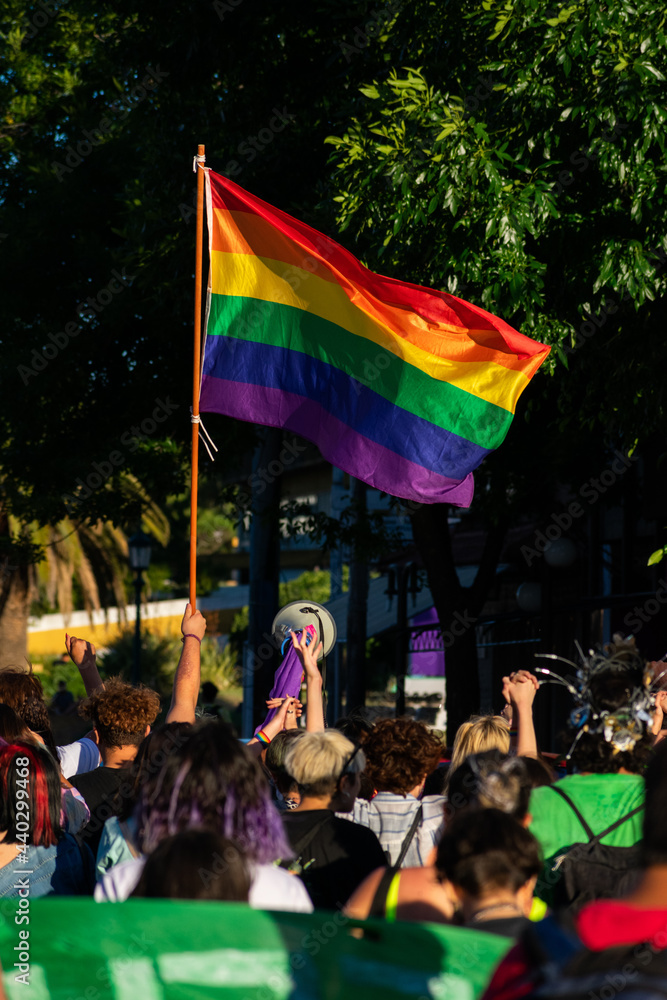 people celebrating gay pride raising lgbtq + flag people celebrating gay pride raising lgbtq + flag
