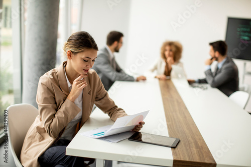 Young woman sitting by the ...