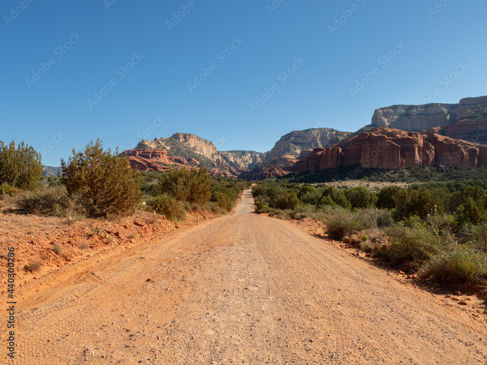 Dirt Road Leading to Rugged Red Rock Mountains in Central Arizona Wide