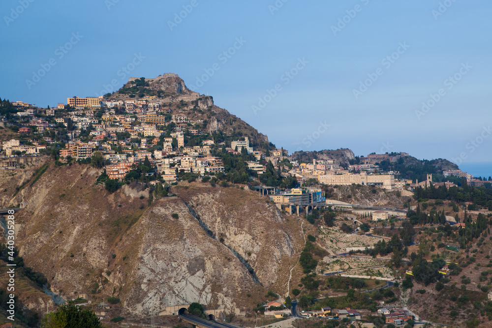 Taormina stands high on cliff overlooking Mediterranean Sea