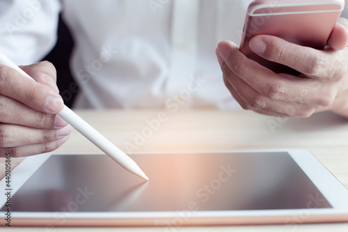 Businessman working and using digital tablet computer, business and technology background with copy space