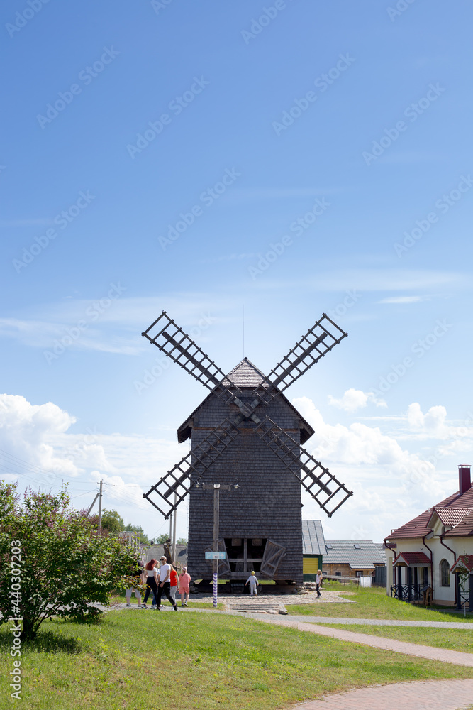 Large windmill against a bright blue sky