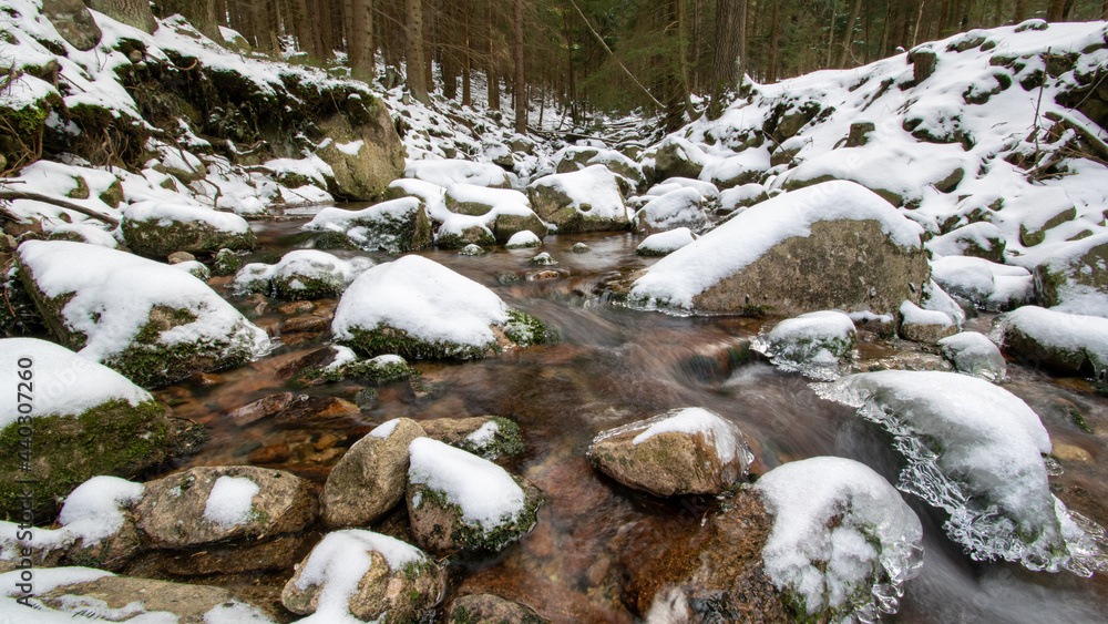 Mountain stream in forest in winter Mountain stream in forest in winter