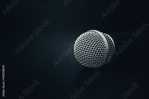 microphone on a black background. black texture with a microphone. music and sound concept © Nazar