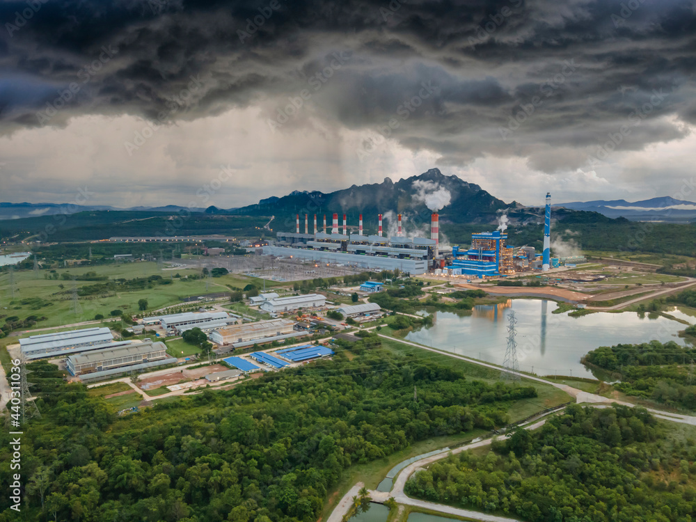 Aerial view, Panoramic view of coal-fired power plants in a large area The machine is working to generate electricity. Beautiful morning sunrise sky, Mae Moh, Lampang Province, Thailand