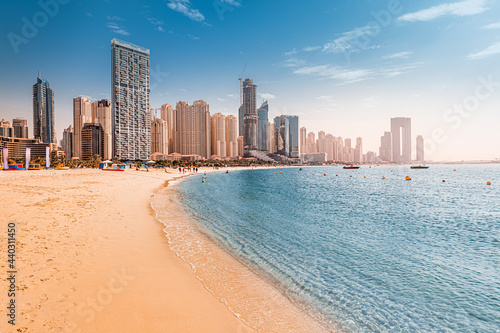 Luxurious sandy beach in the Dubai Marina area with views of the iconic skyscrapers and the warm waters of the Persian Gulf