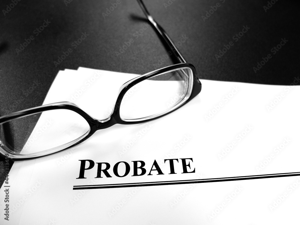 Probate Last Will and Testament Documents on Desk with Glasses Probate Last Will and Testament Documents on Desk with Glasses