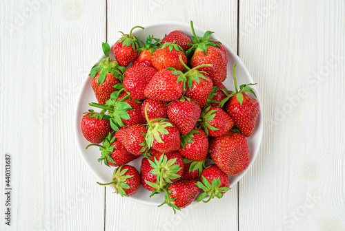 Juicy, ripe strawberries on a white background. Top view, close-up.