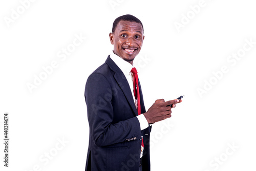 portrait of a happy businessman with cellphone.