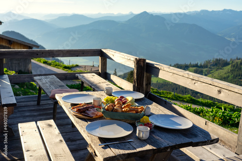 breakfast in a traditional hutte in tirol alms with fruits and wurst photo