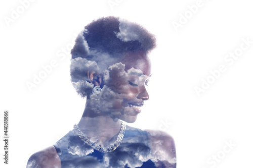 Multiple exposure image with clouds and sky inside positive smiling african american woman portrait. Mental health and calmness.