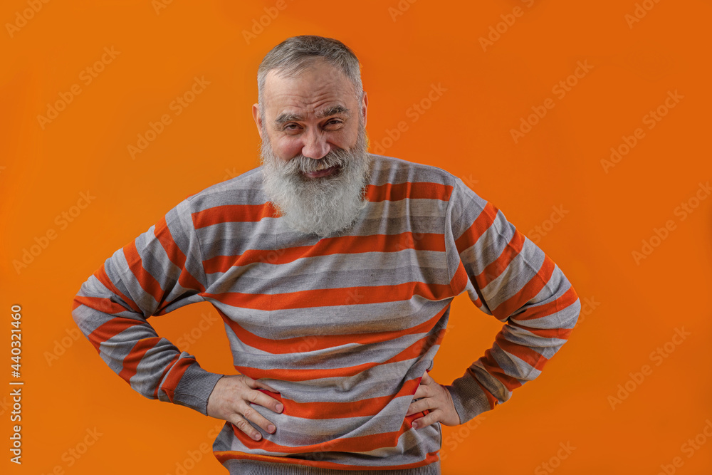 Adult handsome senior male model wearing striped sweater showing Adult handsome senior male model wearing striped sweater showing