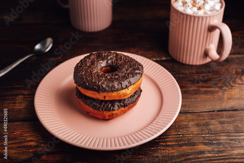 Homemade Chocolate Donuts and Mugs of Hot Chocolate with Marshmallow