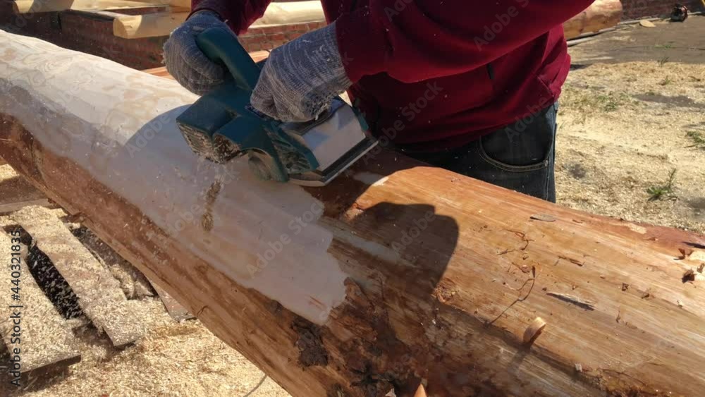 Grinding logs from bark,preparation for construction. High quality 4k footage Grinding logs from bark,preparation for construction. High quality 4k footage