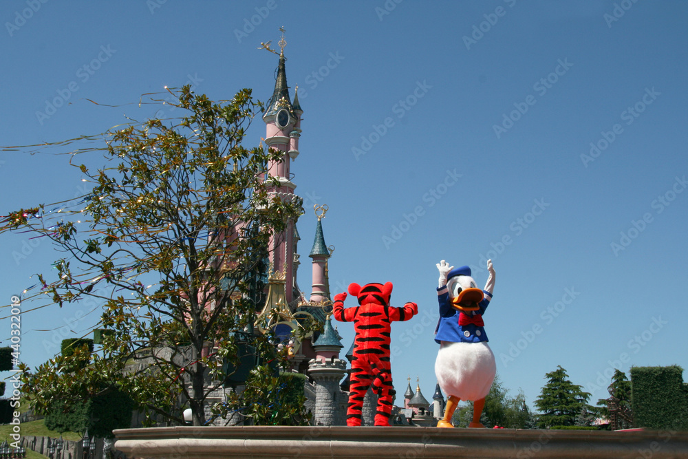 Donald Duck and Tiger in Euro Disney parade. Characters in live show. Walt Disney character in a