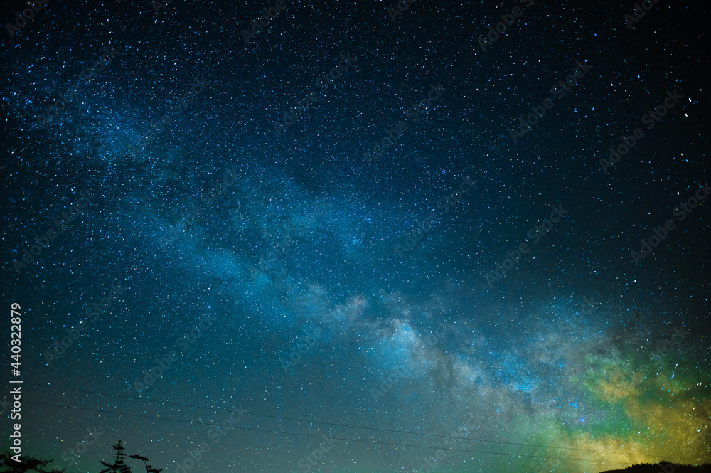 Fototapeta premium In the photo we see the night starry sky. Milky Way. All shades of blue. Minimalism. There is an empty space for your insert. Wallpaper. Texture. Background. No people. Abstraction.