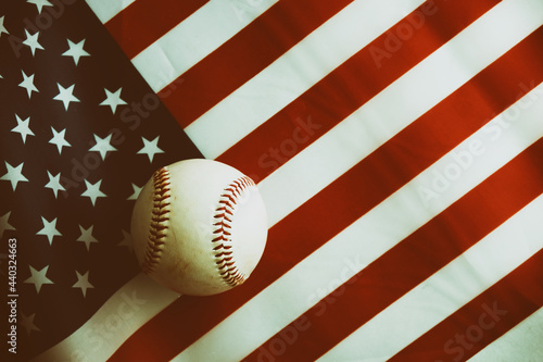 Photography Retro Fourth of July sports background with baseball on American flag as USA holiday symbol
