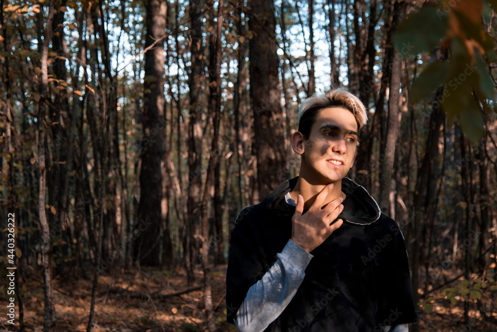 Handsome funny guy is resting in the forest. Unity with nature and cultural recreation. Handsome funny guy is resting in the forest. Unity with nature and cultural recreation.