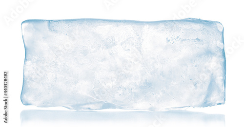 A translucent rectangular block of pure ice, isolated on white background. Purity and freshness concept. photo