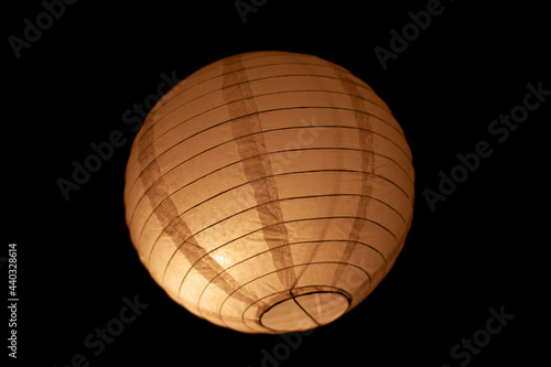 Chinese lamp on a black background.