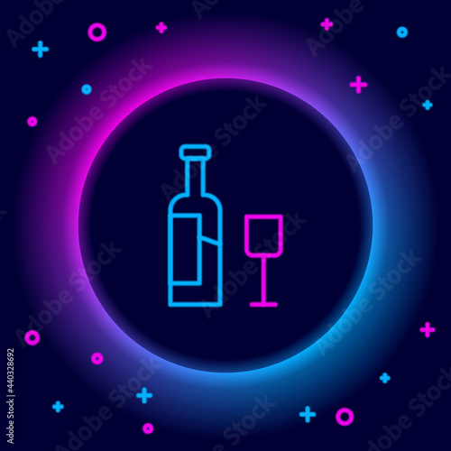 Glowing neon line Wine bottle with glass icon isolated on black background. Colorful outline concept. Vector