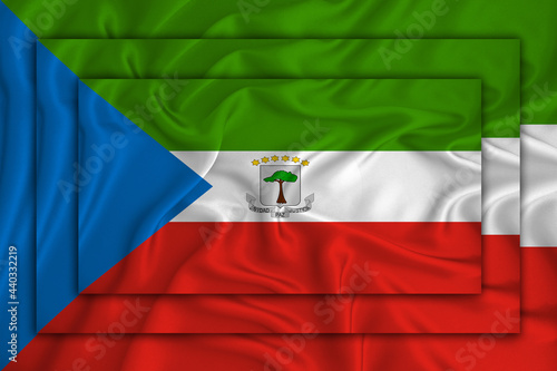 Equatorial Guinea flag on background texture. Three flags are superimposed on each other. The concept of design solutions. 3D-rendering photo