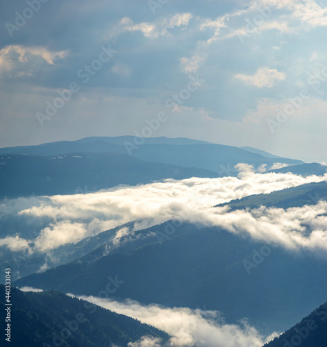 Wooded hills in the sun and fog in the Ukrainian Carpathians © onyx124
