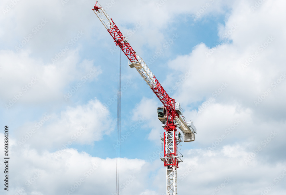 Red-white crane against sky Red-white crane against sky