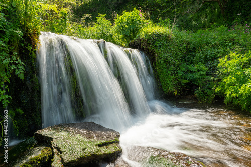 Long exposure of a waterfall flowing onto Lee Abbey Beach in Devon