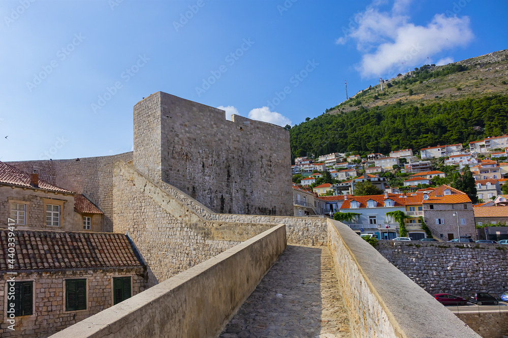 Fortified wall of medieval town Dubrovnik. Croatia. Dubrovnik on Adriatic Sea is one of most prominent tourist destinations, UNESCO World Heritage Site. Fortified wall of medieval town Dubrovnik. Croatia. Dubrovnik on Adriatic Sea is one of most prominent tourist destinations, UNESCO World Heritage Site.