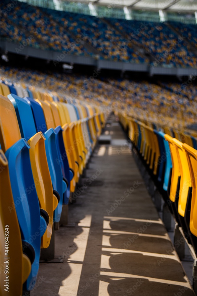 Naklejka premium Empty rows of seats in a football olympic stadium