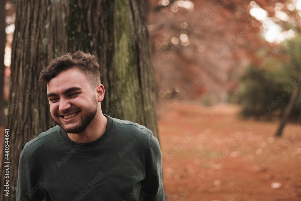 Portrait of a young Caucasian man in a park Portrait of a young Caucasian man in a park