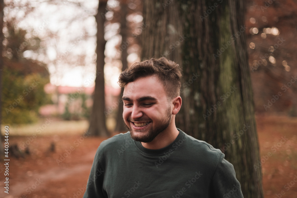Portrait of a young Caucasian man in a park Portrait of a young Caucasian man in a park