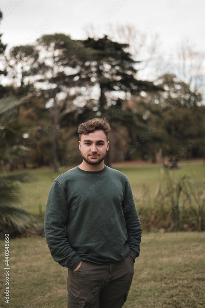Portrait of a young Caucasian man in a park Portrait of a young Caucasian man in a park