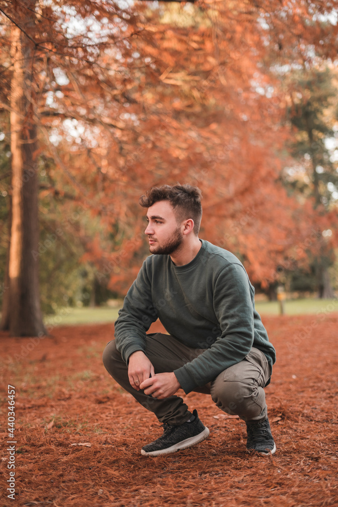 Portrait of a young handsome Caucasian man in a park Portrait of a young handsome Caucasian man in a park